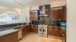 Wood cabinetry, granite counters, stainless appliances